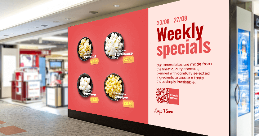 A digital display in a grocery store promoting weekly specials on cheeses, with pricetags.