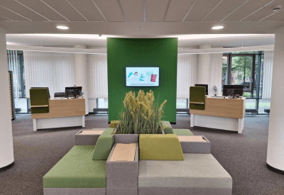 an office with a screen at the waiting room